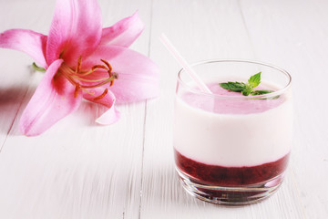 Berry smoothie with yogurt and flower