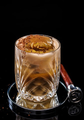 Exotic alcoholic cocktail on a dark background.