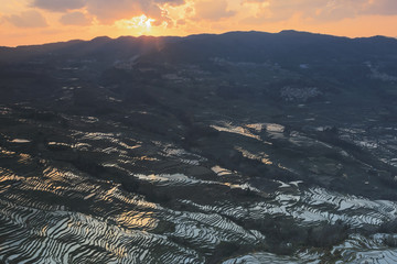 Sunset over YuanYang rice terraces in Yunnan, China, one of the latest UNESCO World Heritage Sites