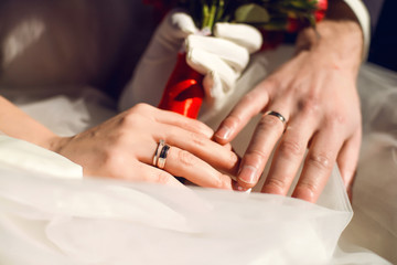 Obraz na płótnie Canvas hands with wedding rings together