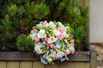 Fototapeta na wymiar two wedding rings on the beautiful wedding bouquet