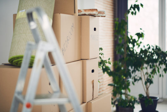 Stack of moving boxes in new house
