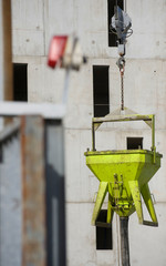 Construction crane and the building against the blue sky