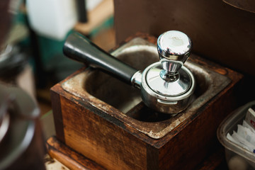Pressed coffee cup on old wooden box.