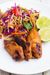 Wings Grill, Asian vegetable salad, lime closeup.