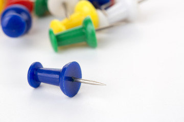 Push pin on white background.