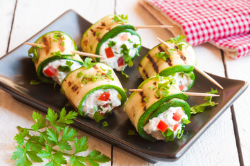 Grilled zucchini rolls stuffed with cheese