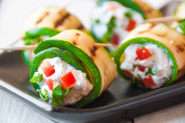 Grilled zucchini rolls stuffed with cheese