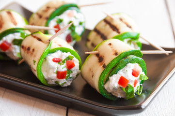 Grilled zucchini rolls stuffed with cheese