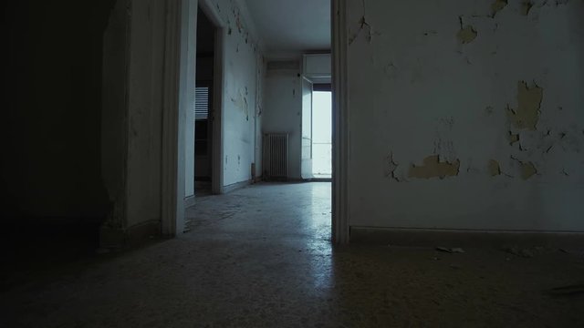 Empty evacuated broken house apartment, interior.Panning inside a derelict abandoned city apartment.