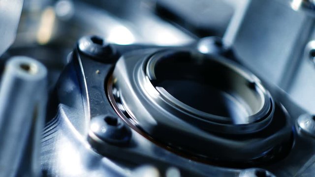 Rotating of metal parts in a mechanical device. Spinning mechanism of car engine