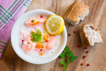 Salmon fish soup with cream and lemon