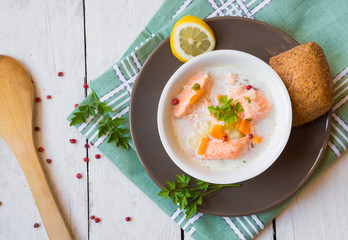 Salmon fish soup with cream and lemon