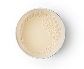 Cup with soy milk bubble foam on top view texture background object design
