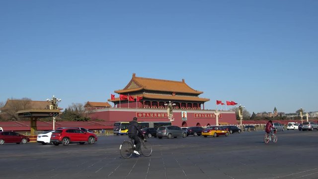 cars driving on Chang'an street in front of Tiananmen rostrum