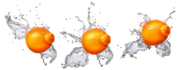 Water splash and fruits isolated on white backgroud. Fresh mandarin