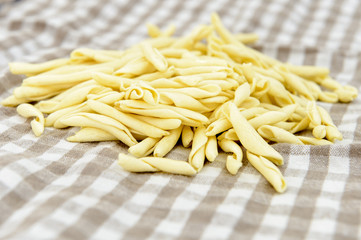 closeup of pasta on checked towel