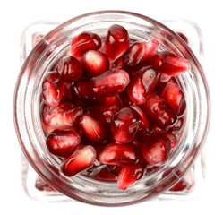 Pomegranate seeds in a glass container