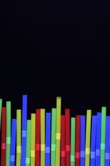 cocktail colorful plastic tube on a black background