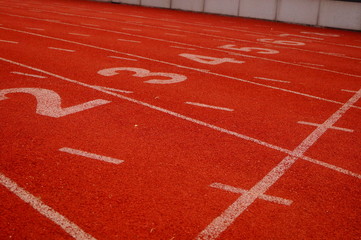 Fototapeta premium Red plastic track and field track