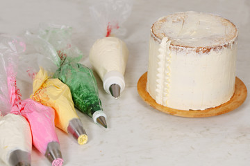 Сake and packets with cream