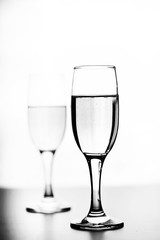 monochrome photo of champagne on white table on white background isolate