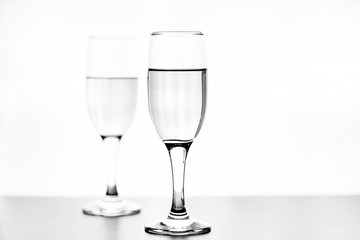 monochrome photo of champagne on white table on white background isolate