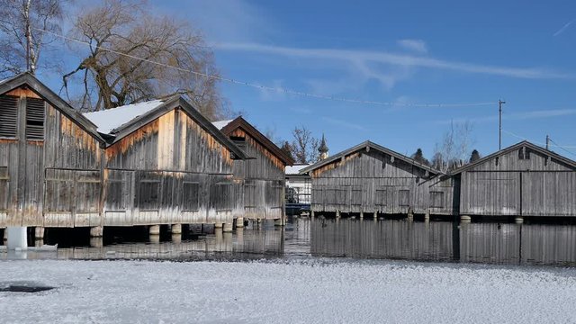 Boat huts at the frozen Lake Staffelsee in Winter