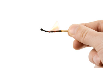 burning match in the hand isolated on white background