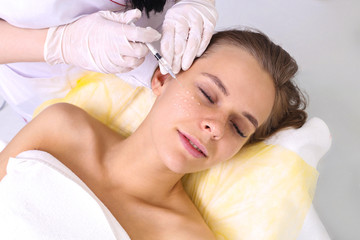Mesotherapy injections in the face.