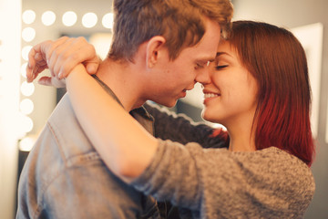 Romantic couple touching and kissing each other