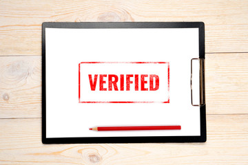verified red stamp on empty paper