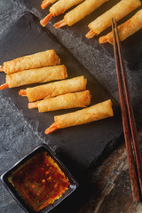 Fried rolls with prawns, served with sweet chili sauce and chops