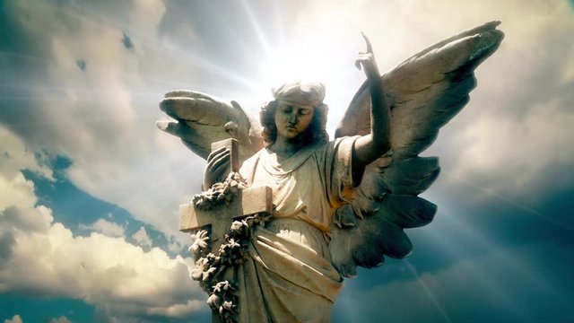 Angel 1012: The statue of an Angel on time lapse clouds (Loop).