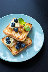  French toasts with fresh blueberries and maple syrup
