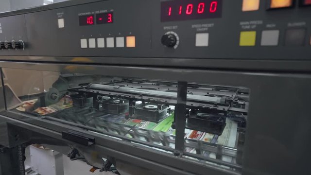 Offset printing press, printing production, industrial machine. Print house. 4k footage.
