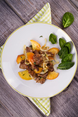 Liver with apple, spinach and onion. View from above, top studio shot