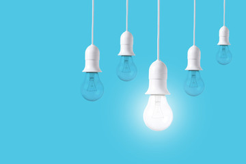 difference light bulb on blue background. concept of new ideas with innovation and creativity.