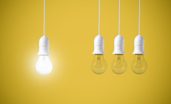 difference light bulb on yellow background. concept of new ideas with innovation and creativity.