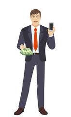 Businessman with money holding mobile phone