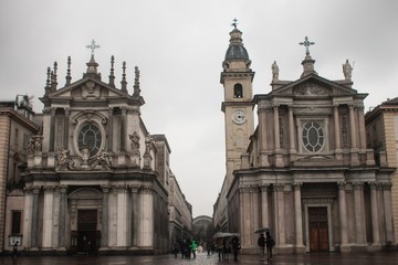 Fototapeta na wymiar Turin (Torino), Italy - February 15, 2017: Tourists in Piazza San Carlo square and the church in Piazza San Carlo (Chiesa di Santa Cristina e Carlo) 