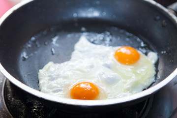 twin fried eggs on the pan
