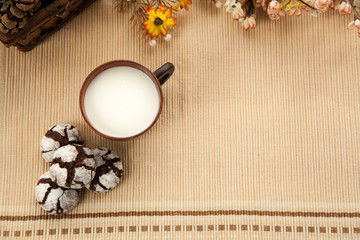 Homemade organic cookies with cocoa and chocolate, favorit grandmother's biscuit with cup of milk. Free space for text.