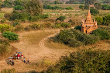 top view of tourists horse carriage near old pagoda at Bagan Kingdom, Myanmar.