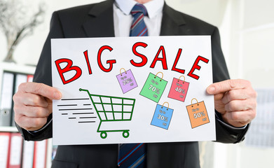 Big sale concept shown by a businessman