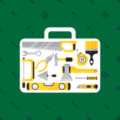 Construction tool in tool box on green background