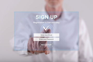 Man touching a signup concept on a touch screen