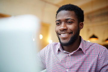 Young designer working in front of laptop