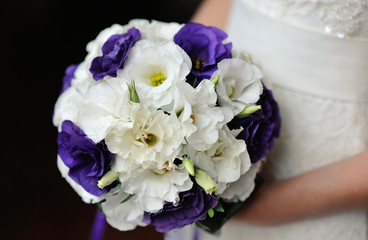 Bride holding beautiful wedding bouquet