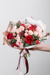 Rich bunch flowers in hand Fresh spring bouquet. Summer Background.